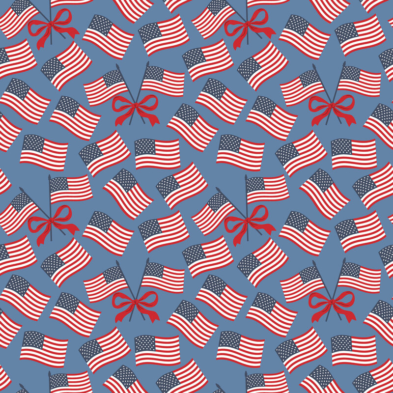 Blue fabric with tossed American flags and red bows.