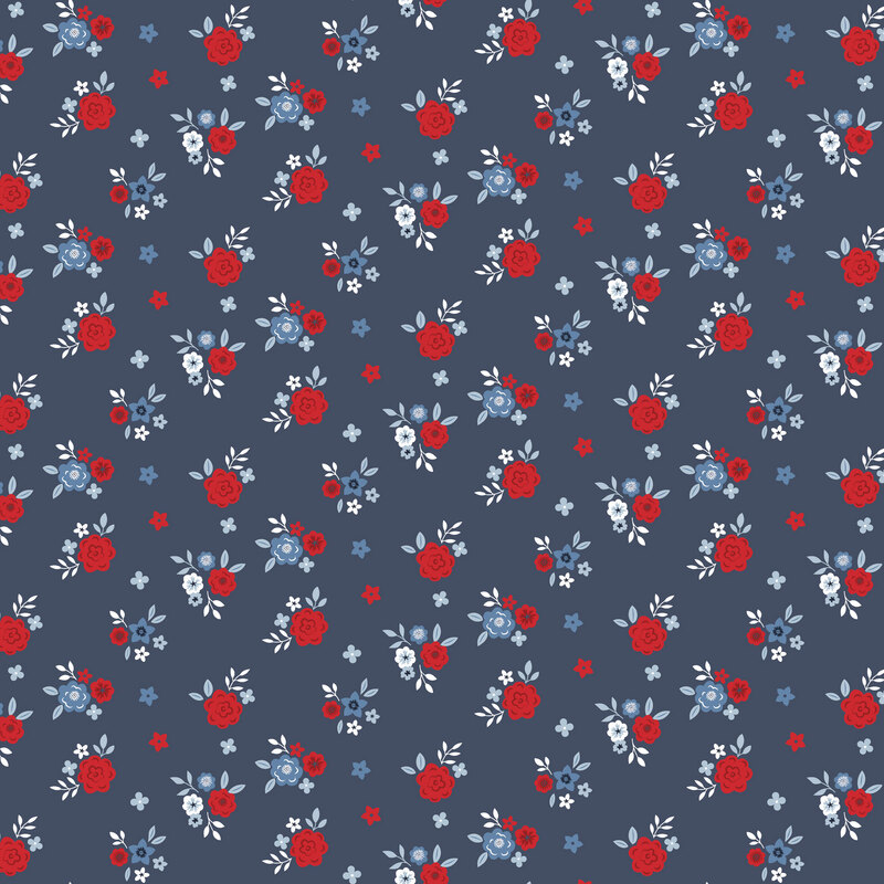 Denim blue fabric with ditsy red and light blue floral print.