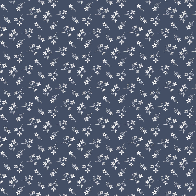 Denim blue fabric tossed with calico print of white florals.