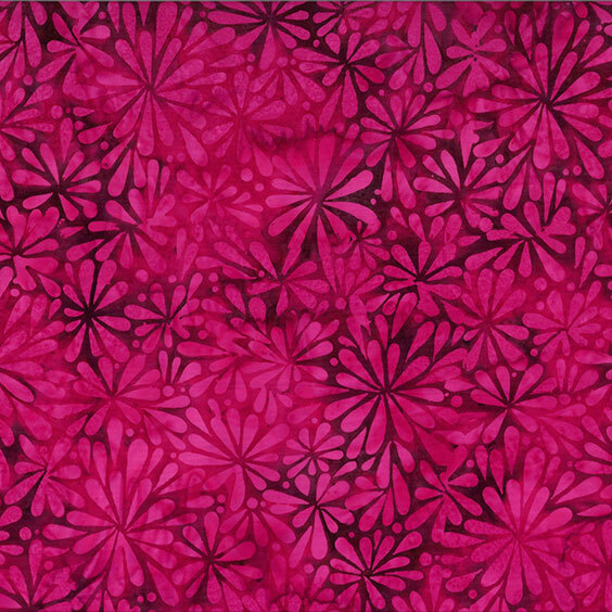 Rich red batik with a packed hot pink blooming floral design across the top.