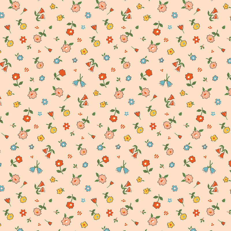 An assortment of flowers tossed onto a pale coral orange fabric.