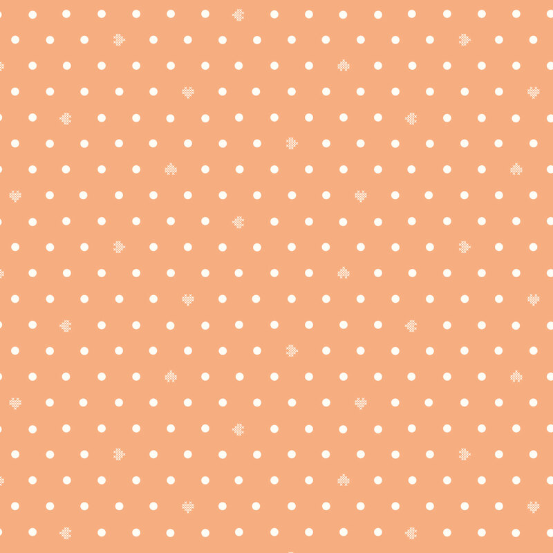 Coral fabric with white polka dots and small cross stitch hearts.