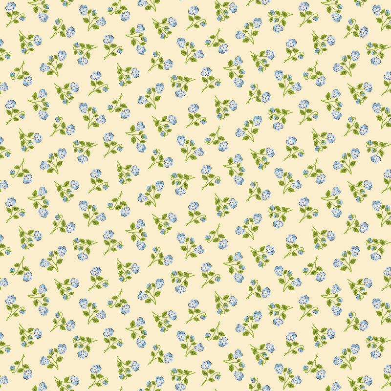 cream fabric with a tossed pattern of blue floral sprigs with green stems.