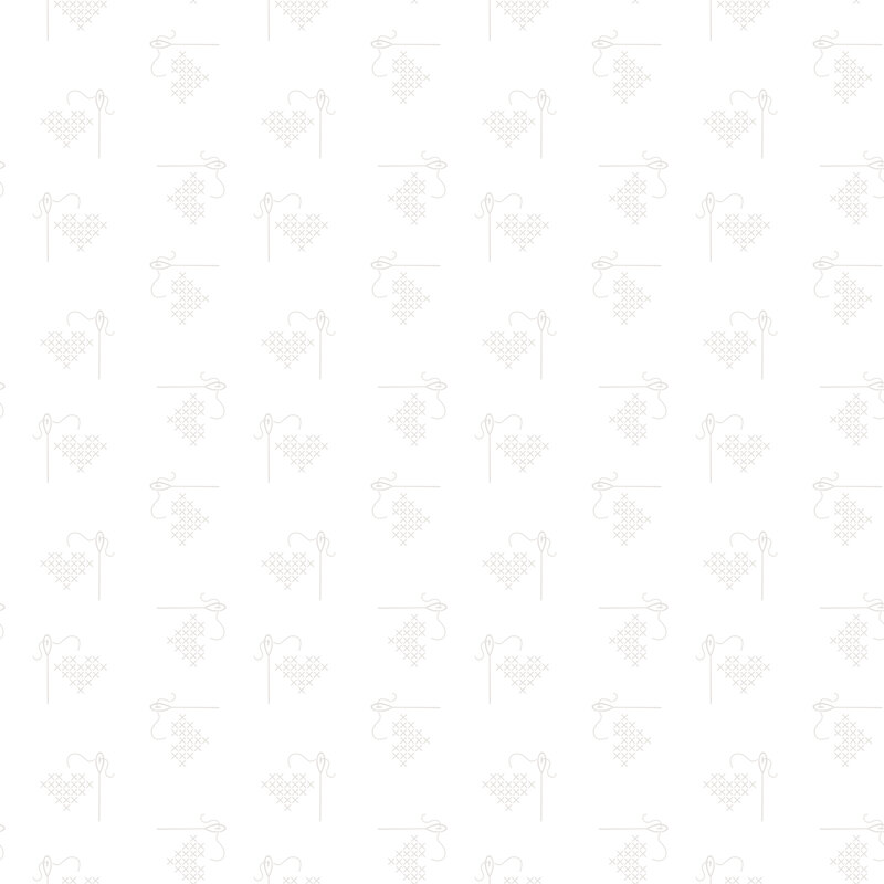 A fabric with stitched hearts, needles, and thread.