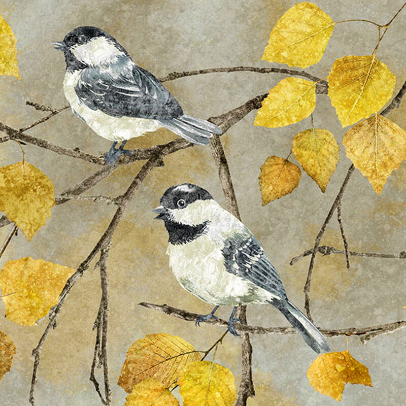 A fabric featuring two chickadees resting on an autumnal tree branch. 