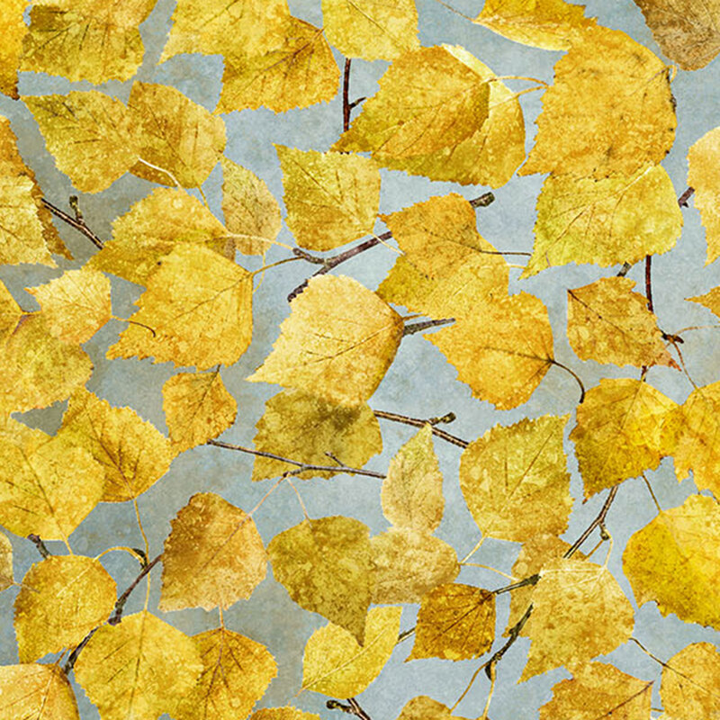 A gray-blue fabric featuring autumnal leaves and branches.