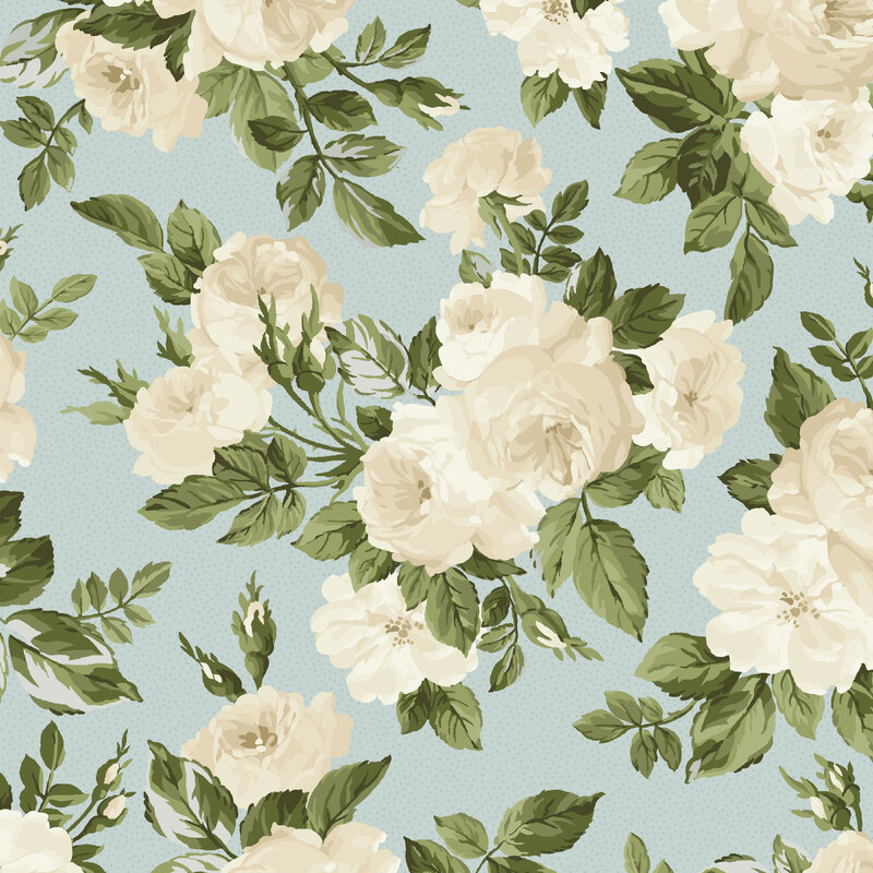 Light blue fabric overlayed with white roses and dark green leaves.