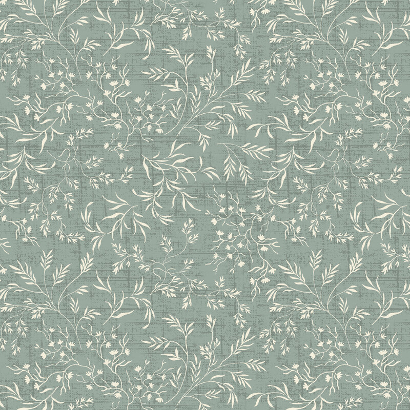 Mist distressed tonal fabric with vines and leaves strewn over the top.