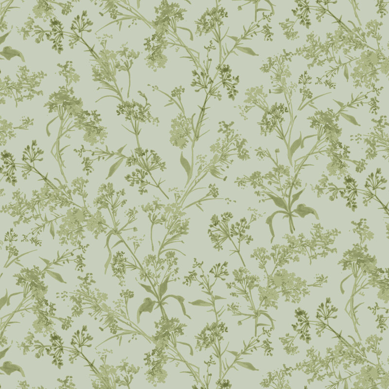 Sage green fabric with soft green branches and leaves spread across the top.