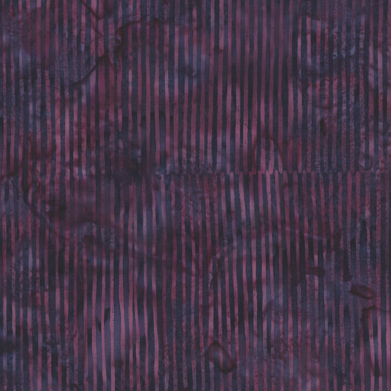 Deep plum and purple striped batik fabric.