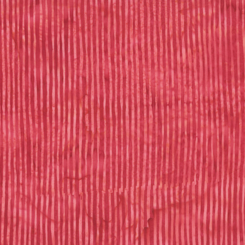 Strawberry red tonal striped batik fabric.