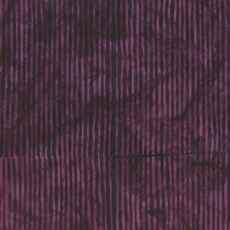 Dark plum striped batik fabric.