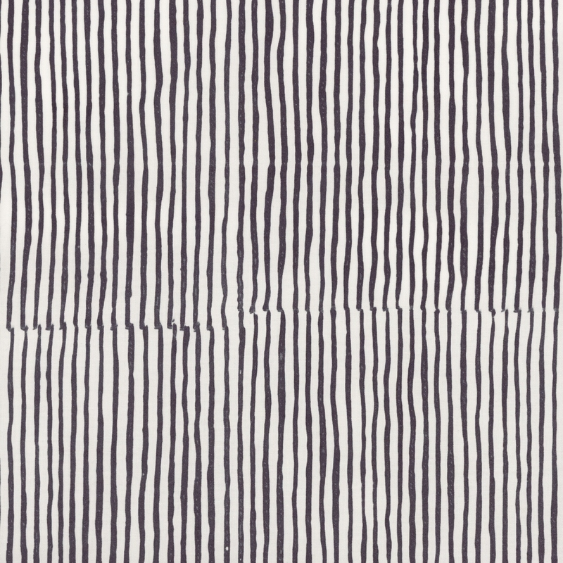 Black and white striped batik fabric.