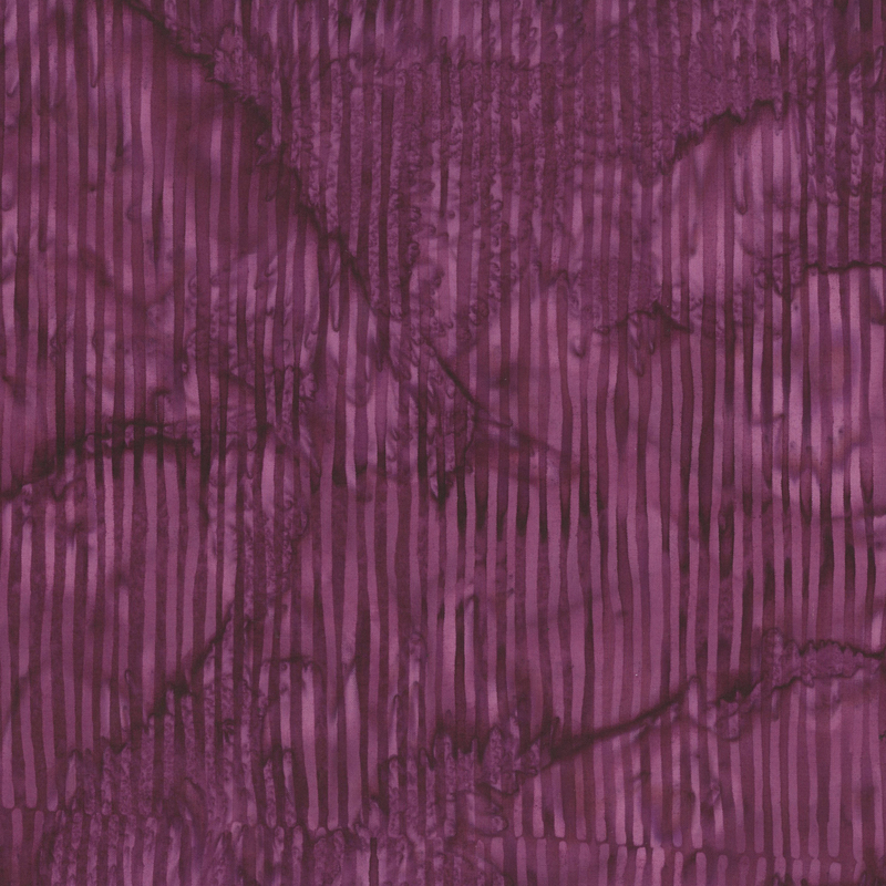 Burgundy striped batik fabric.
