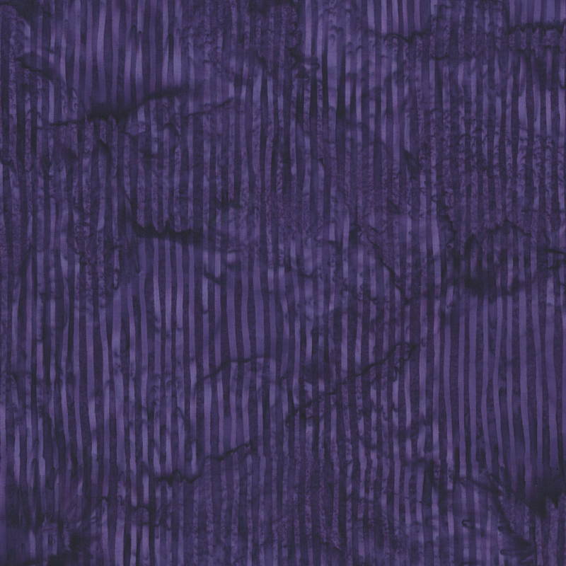 Deep purple striped batik fabric.
