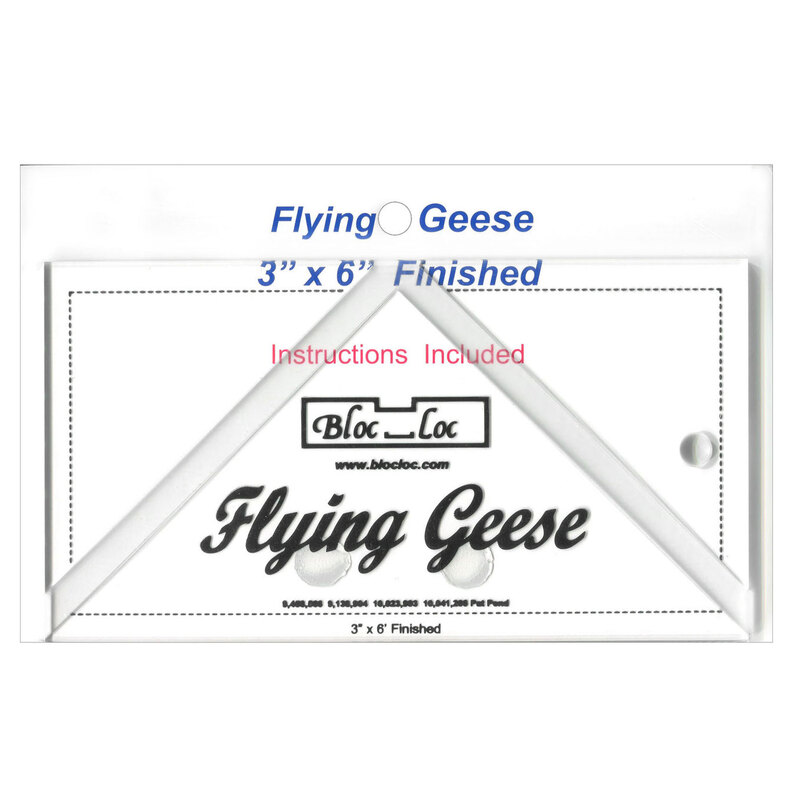 The 3" x 6" Flying Geese Ruler in its packaging and isolated on a white background. 