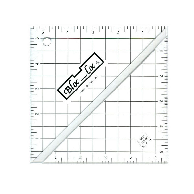 The 5.5" Half-Square Triangle Ruler in its packaging and isolated on a white background. 