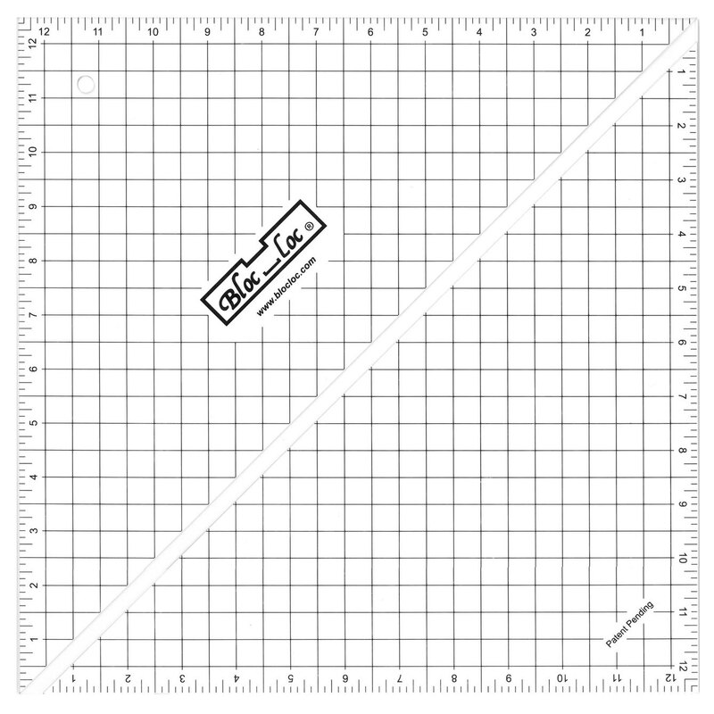 The 12.5" Half-Square Triangle Ruler in its packaging and isolated on a white background. 