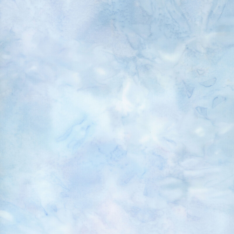 Pale blue watercolor batik fabric with subtle lavender mottling.