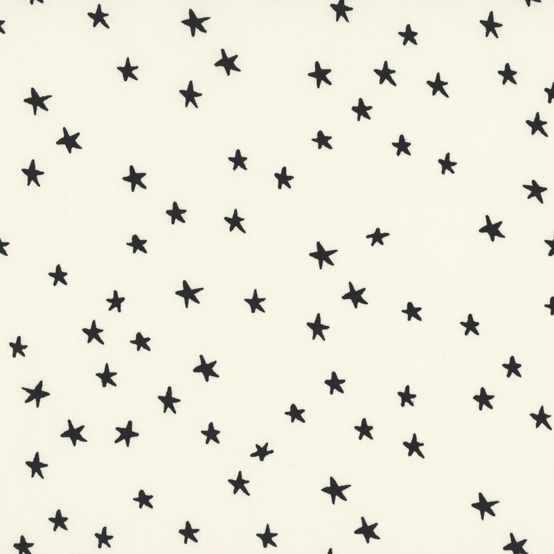 cream 108" wide fabric featuring black stars.