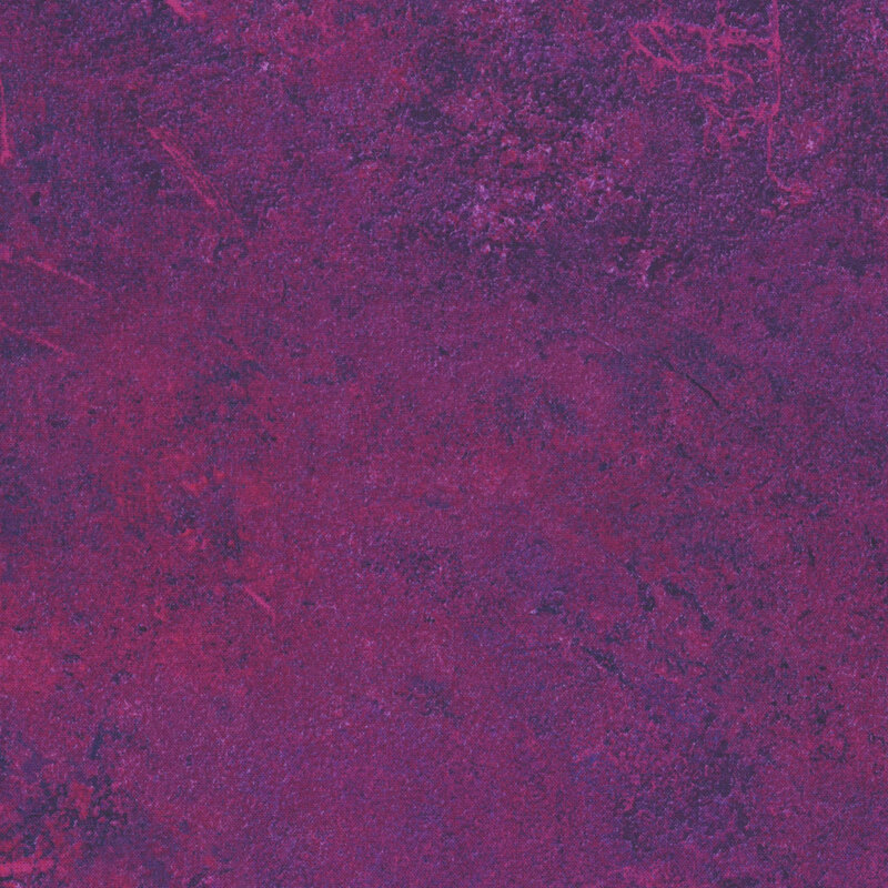 Dark magenta fabric with a pink textured surface that emulates the look of natural stone. 