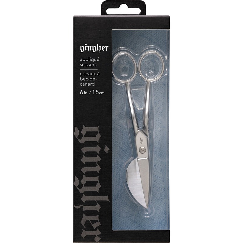 The appliqué scissors in their packaging isolated on a white background. 