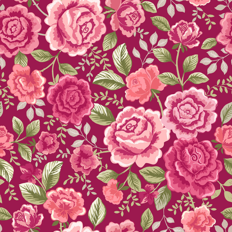 Dark raspberry fabric with leaves and red-pink roses strewn across the top. 