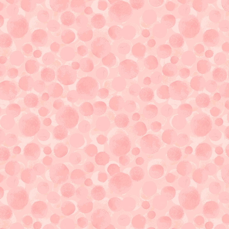 Soft pink fabric with tonal, rosy mottled circles.