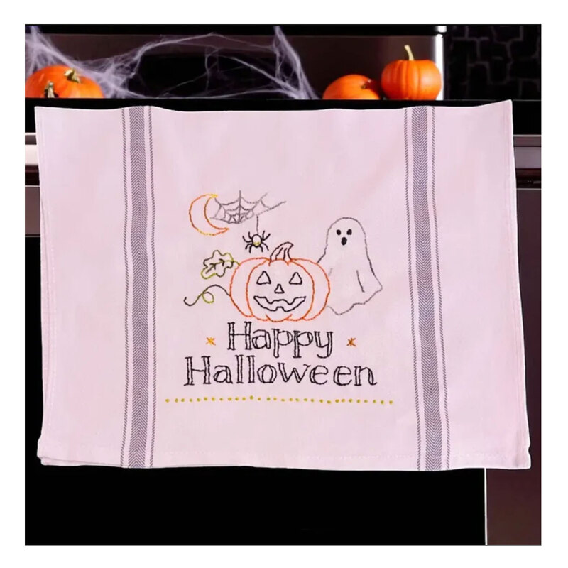 A decorative kitchen towel featuring a ghost and jack-o'-lantern.
