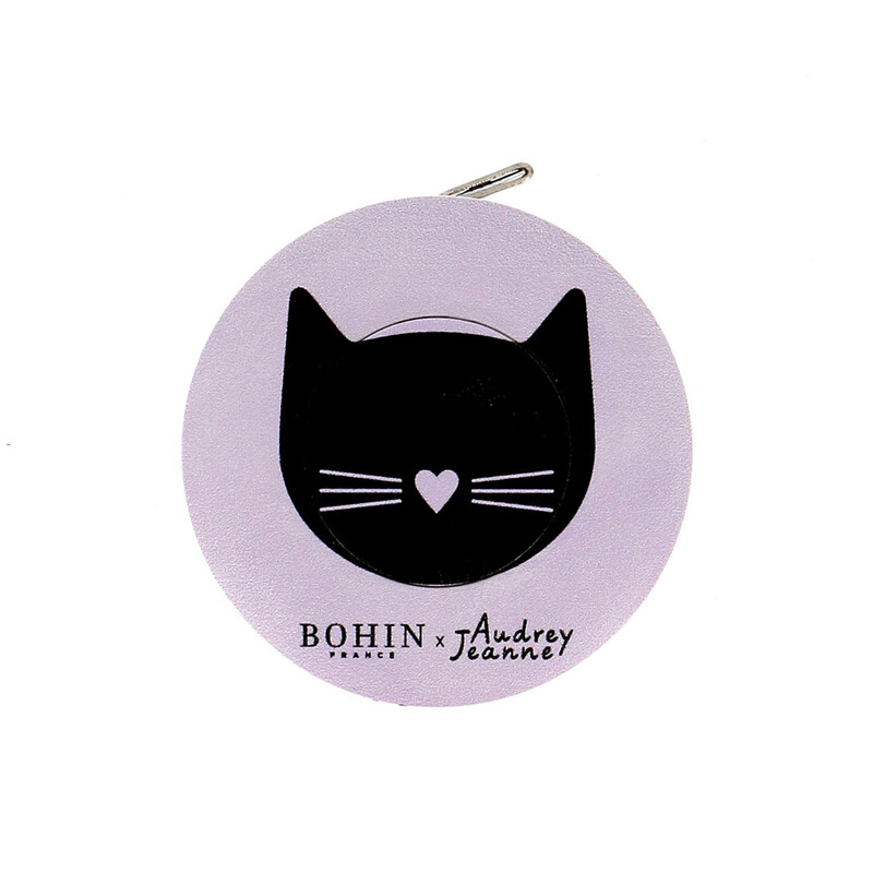 An isolated shot of the pink cat tape measure by Bohin on a white background. 
