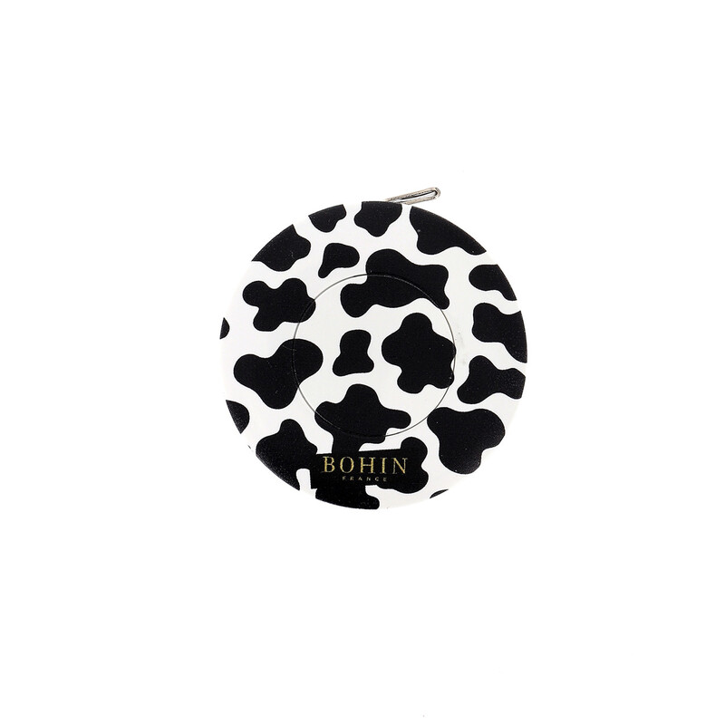 An isolated shot of the cow print tape measure by Bohin on a white background. 