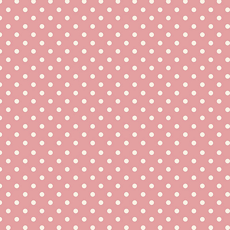 Soft pink fabric with a simple, soft cream polka-dot pattern.