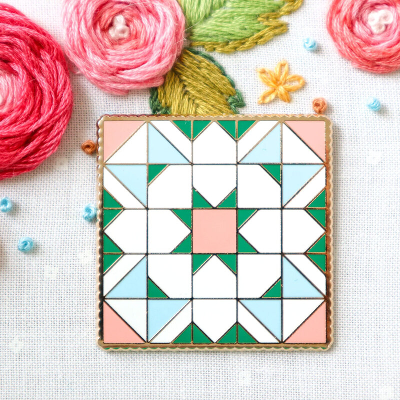 The Shining Star Quilt Block needle miner displayed on a hand embroidery project.