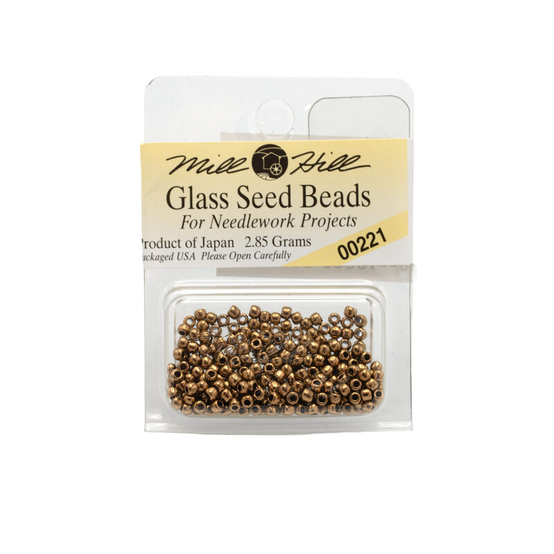 A package of Mill Hill Glass Seed Beads in the color bronze. 
