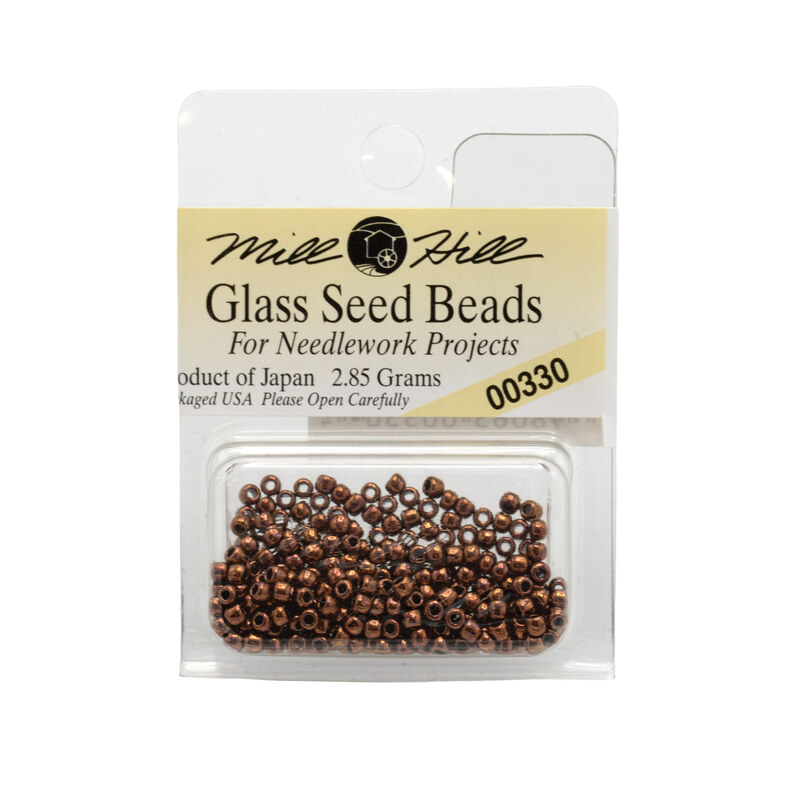 A package of Mill Hill Glass Seed Beads in the color copper. 