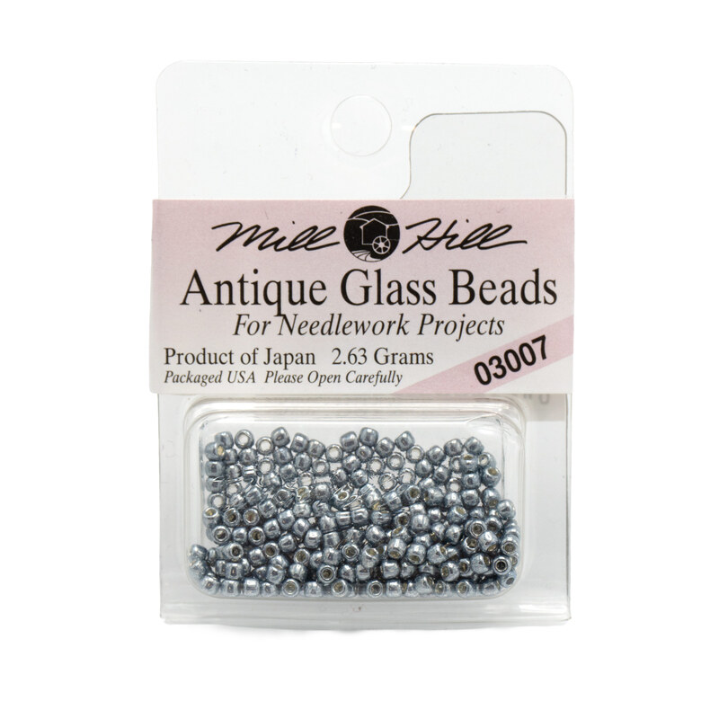 A package of Mill Hill Antique Glass Seed Beads in the color silver moon. 