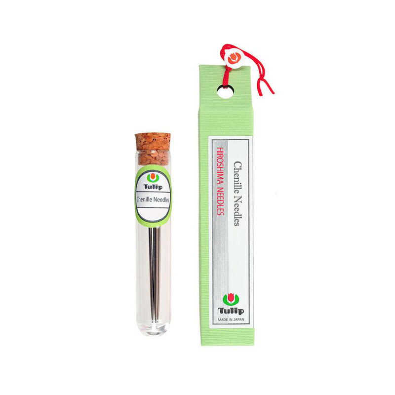 6 piece set of #22 Tulip chenille needles in a thin container next to a green carton package.