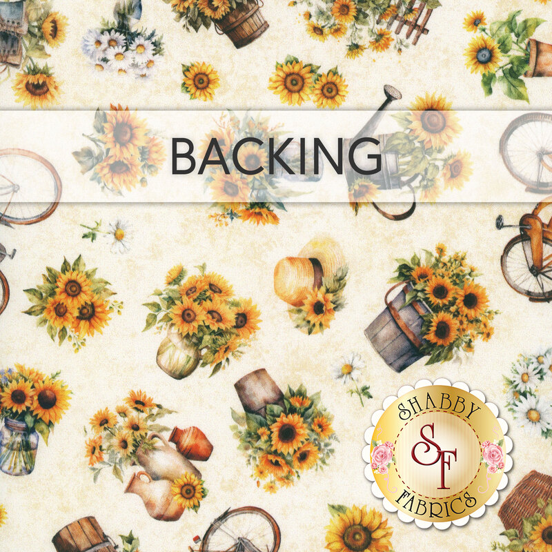 A swatch of cream fabric with tossed baskets, vases, and hats with sunflowers. A banner at the top reads "Backing" and a golden Shabby Fabrics logo sits in the bottom right corner.