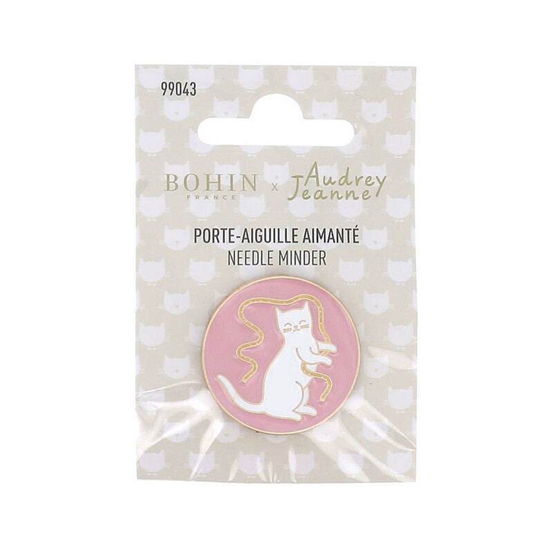 A white cat magnetic needle minder in its packaging. 