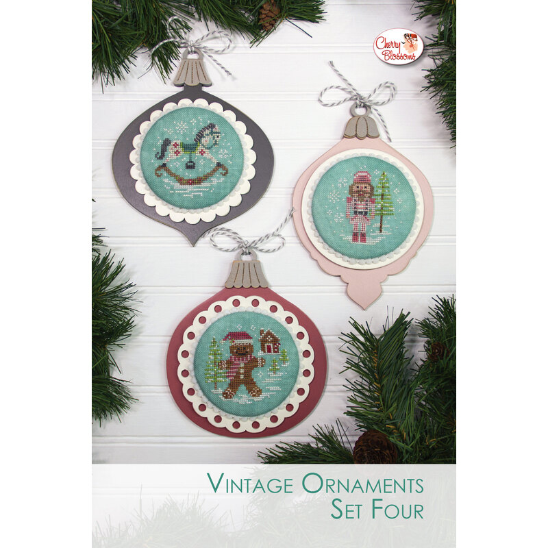 The completed projects, staged on a wooden background and surrounded by coordinating festive greenery.