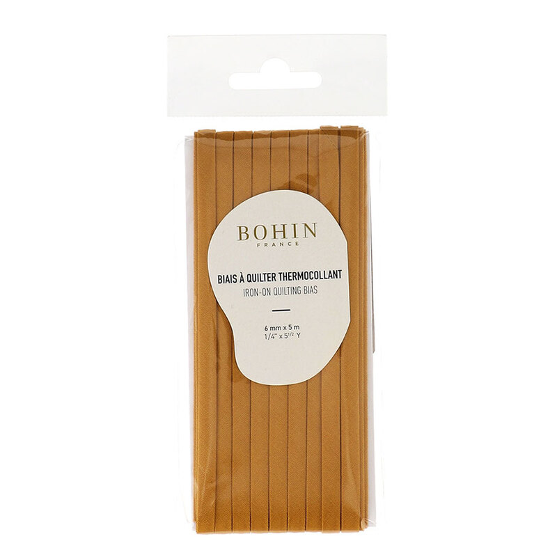 Mustard bias tape in packaging labeled Bohin iron on quilting bias, isolated on a white background.