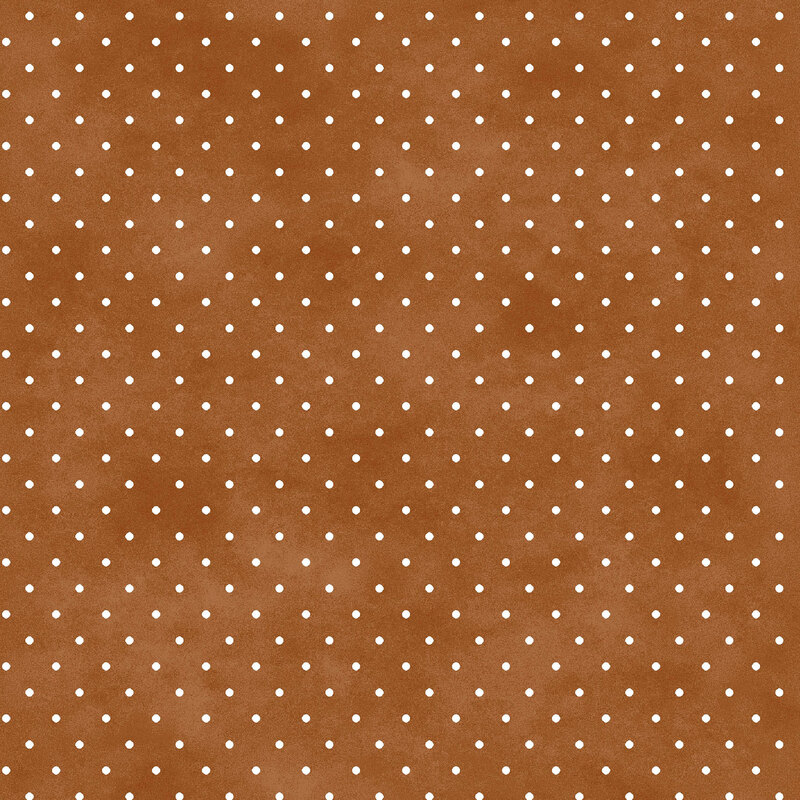 Mottled brown fabric with small white polka dot pattern.