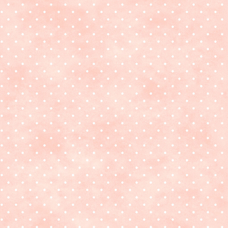 Mottled light coral pink fabric with small white polka dot pattern.