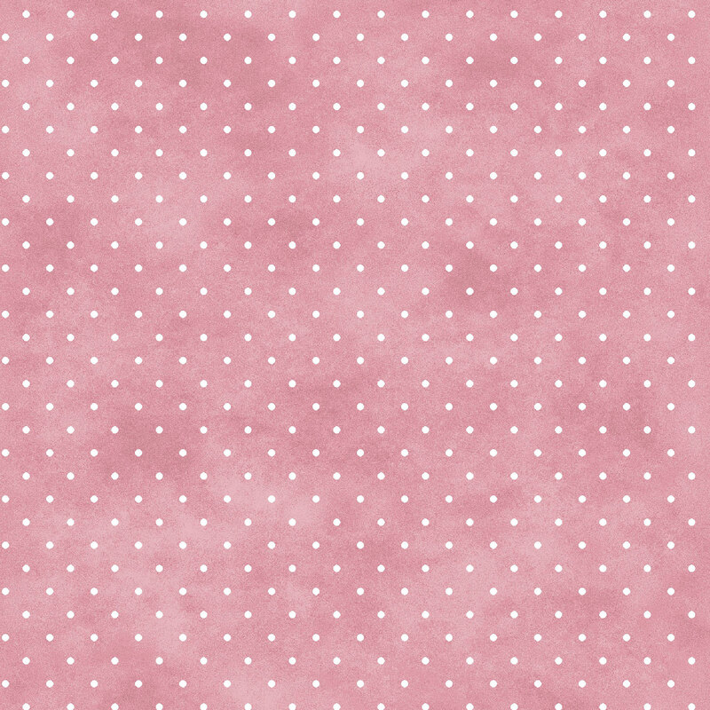 Mottled dusty rose fabric with small white polka dot pattern.