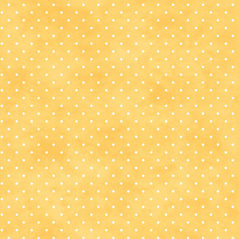 Mottled golden yellow fabric with small white polka dot pattern.
