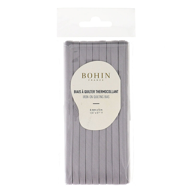 Grey bias tape in packaging labeled Bohin iron on quilting bias, isolated on a white background.