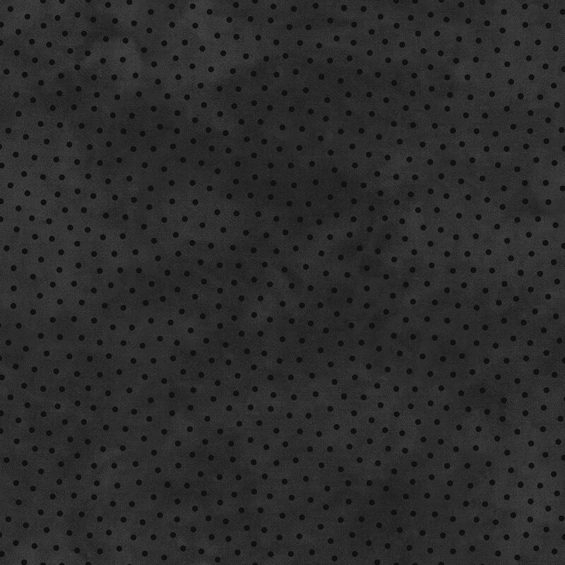 Mottled black fabric with scattered tonal dots.