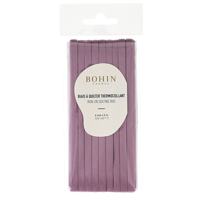 dark mauve bias tape in packaging labeled Bohin iron on quilting bias, isolated on a white background.