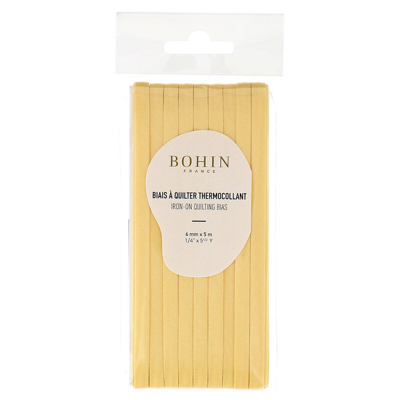 Wheat yellow bias tape in packaging labeled Bohin iron on quilting bias, isolated on a white background.