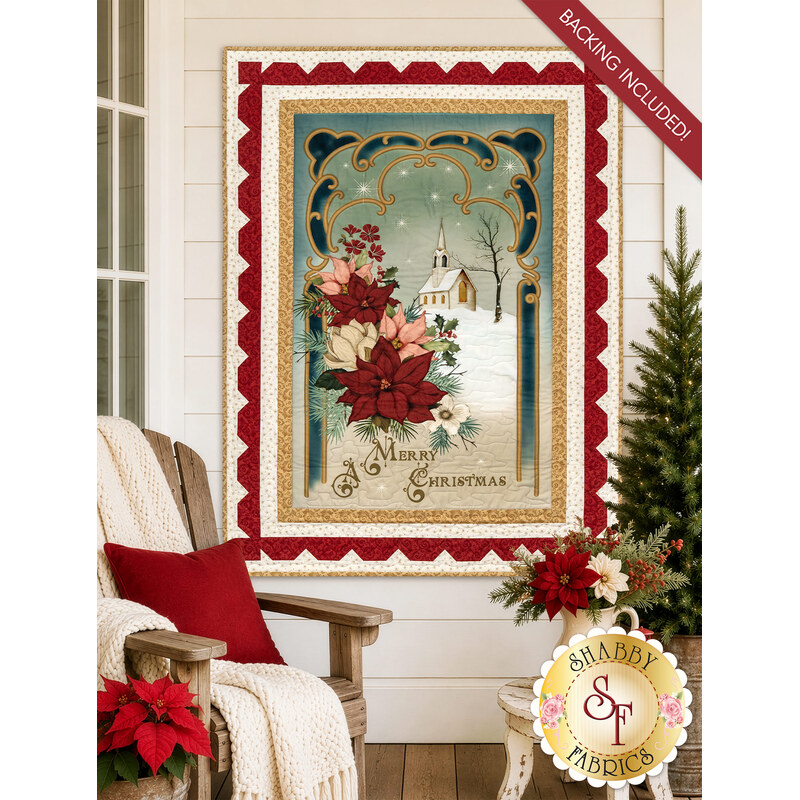 The completed Christmas Greetings Panel Quilt, colored in cream, green, red, pink, and blue fabrics from the Christmas Greetings collection by Riley Blake Designs,  staged on a white porch wall with coordinating décor. A red banner at the top reads "Backing Included!"